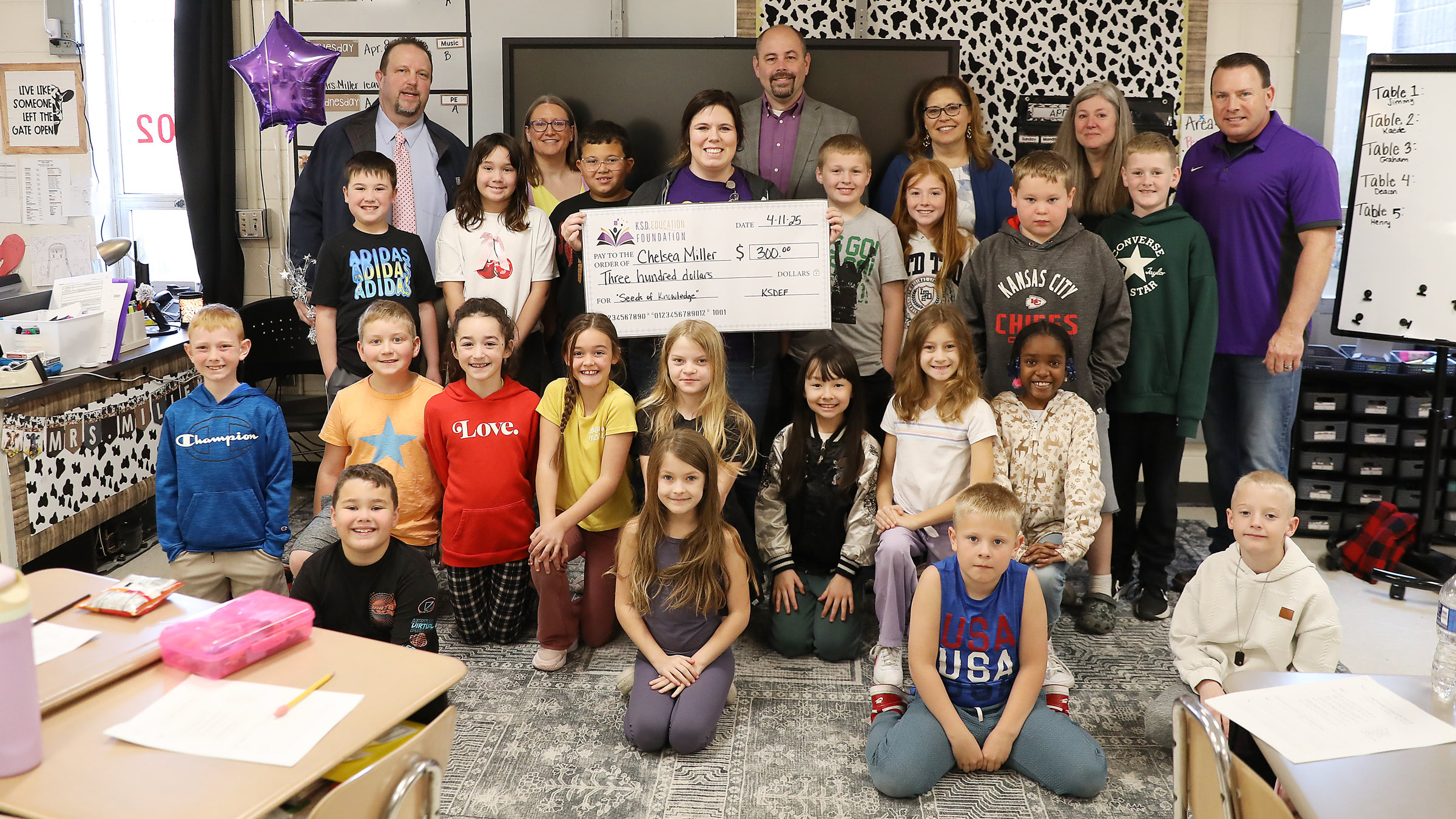 Volunteers with the Kearney School District Education Foundation present a $300 Teacher Innovation Grant to Chelsea Miller on April 11, 2025, at Hawthorne Elementary.
