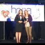 Lawrence receive award on stage at HOSA conference