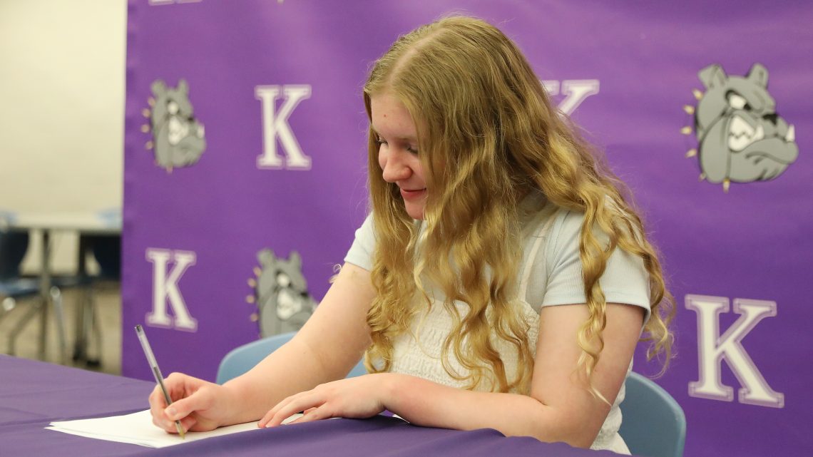 A Kearney High School student signs a letter of intent to earn a college degree in education.