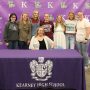Kearney High School Education Internship students pose with teacher Mendy Salmonson following the school's Future Educator's Signing Day ceremony.