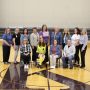 Current and former LENS faculty members pose for a photo following a celebration of the school on April 25, 2025.