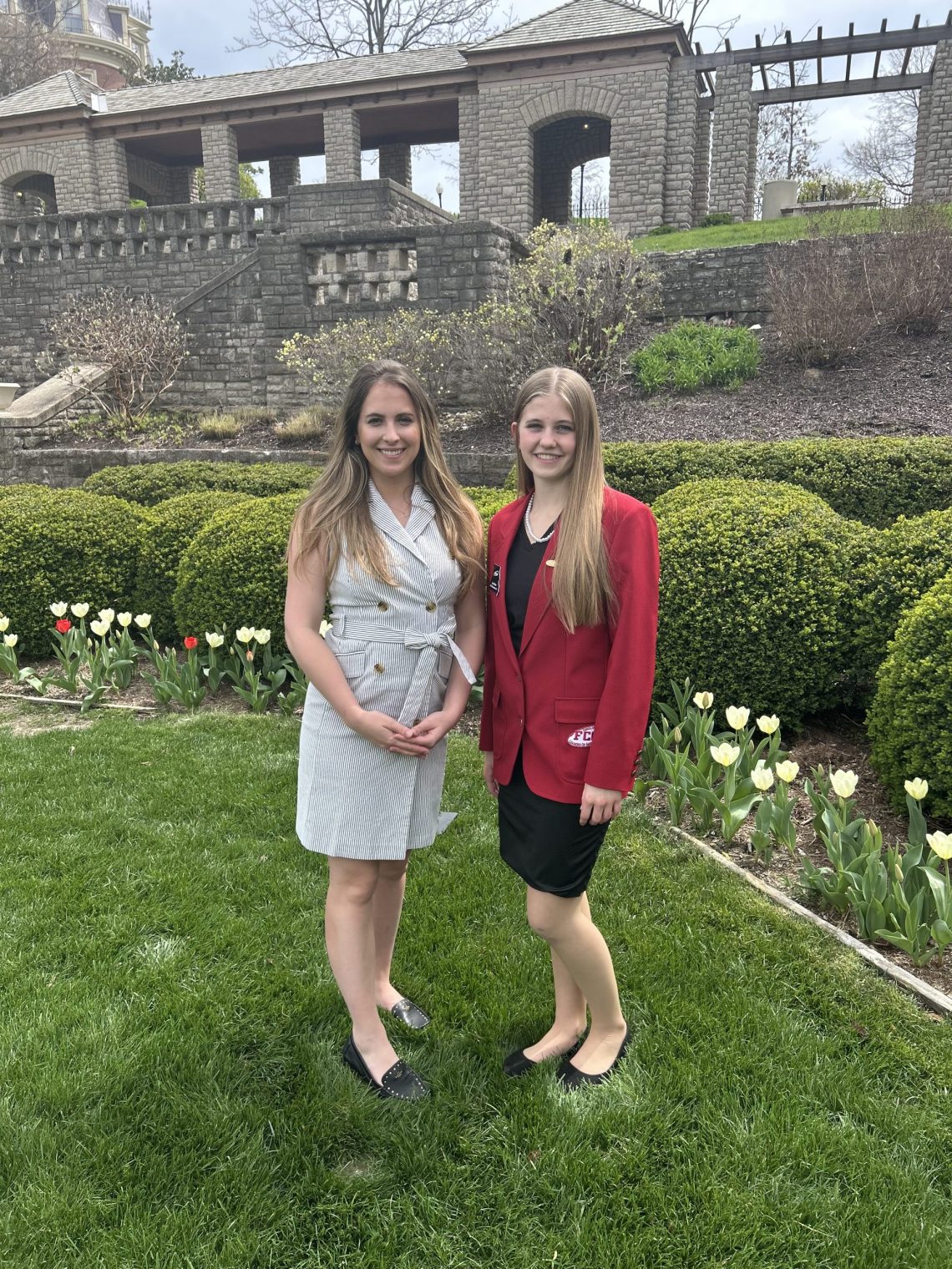 Representative Mazzie Christensen poses with KHS senior Lexie Barton on the state capital grounds.