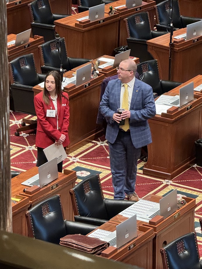 KHS senior Madelyn Whitten stands on the Missouri House of Representatives floor with Rep. Josh Hurlbert.