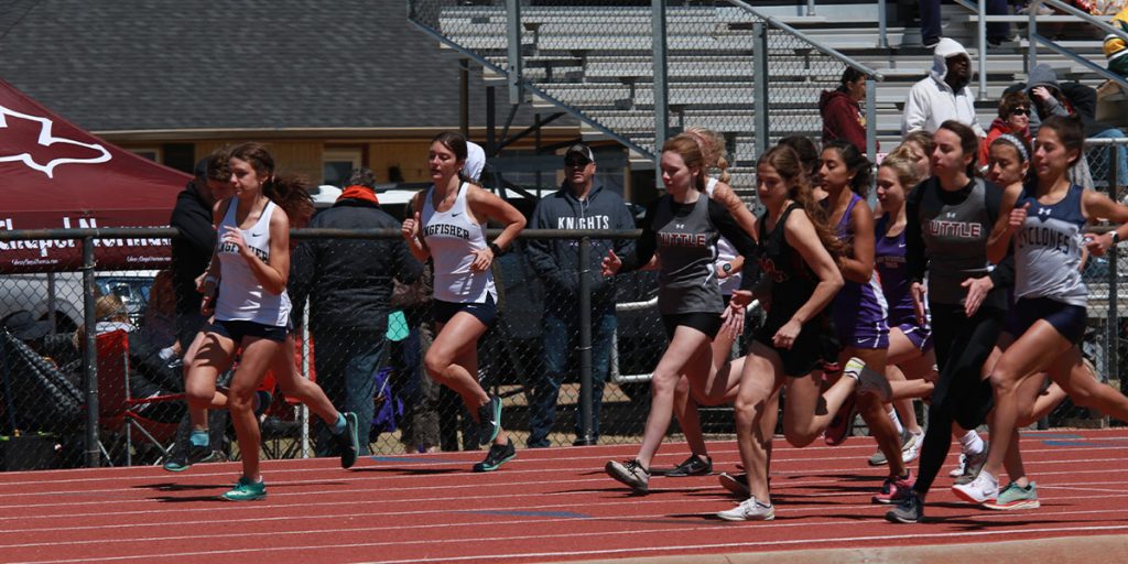 Students running for Kingfisher Public Schools at a track meet