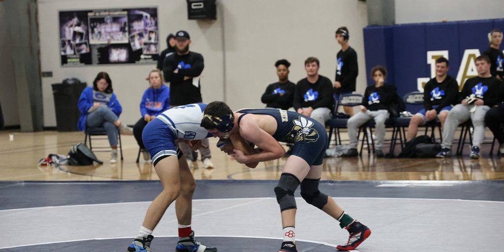 Kingfisher public schools wrestler competing in a match