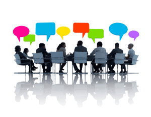 Committee Members talking at a table.