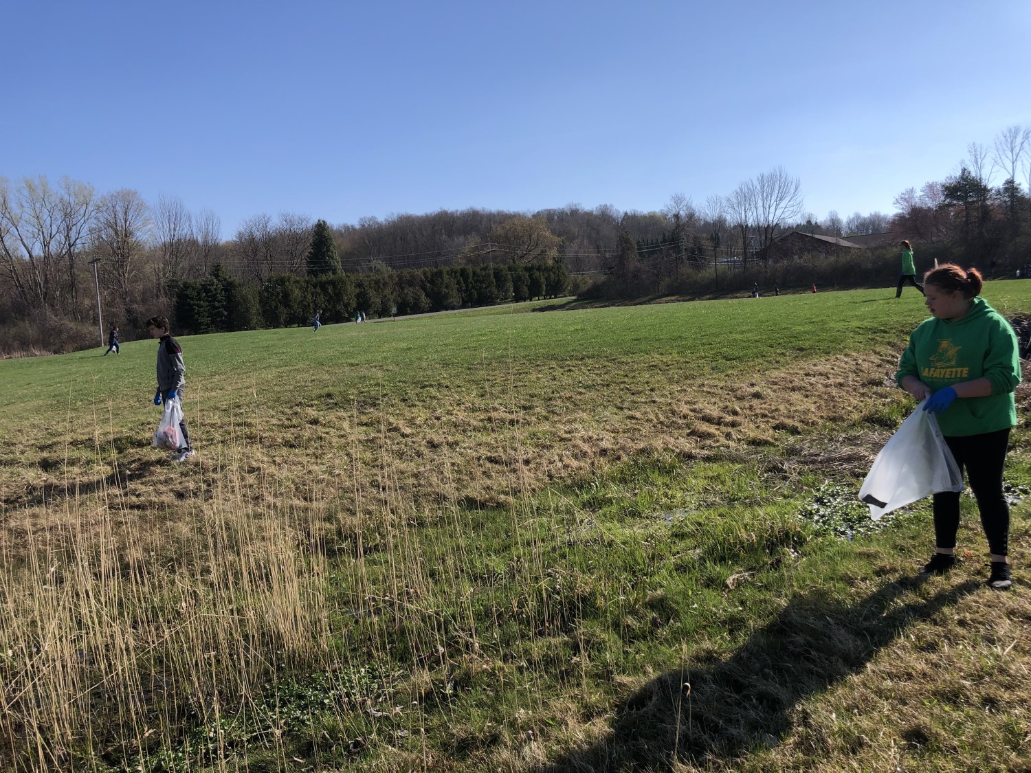 students looking for trash