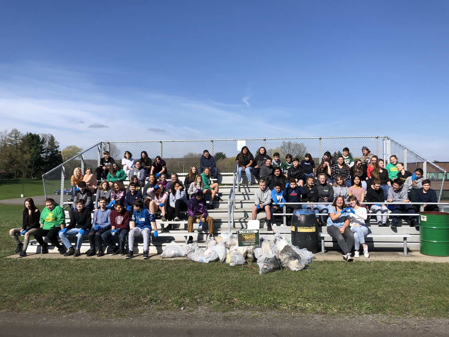 students pose for picture on the rafters