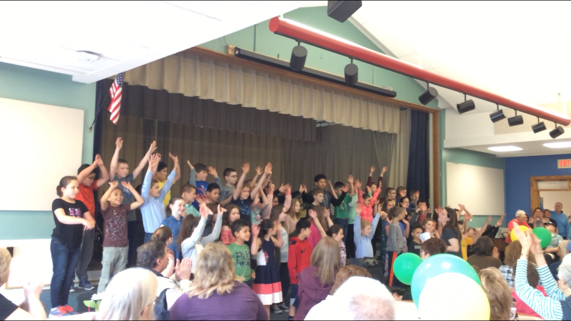 student chorus sings for guests