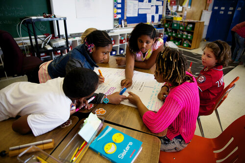 Fifth-graders discuss the meanings of difficult words during a Common Core-inspired reading lesson. Fifth-graders discuss the meanings of difficult words during a Common Core-inspired reading lesson.