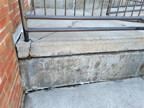 Deterioration of High School ramp at front entrance