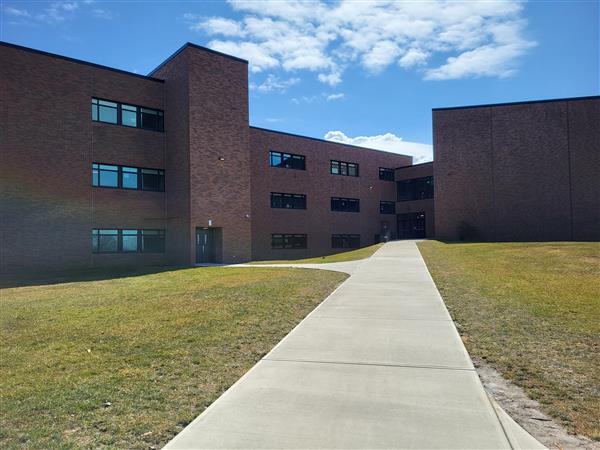 Middle School facade ... foundation deterioration is occurring at the 3-story instruction wing at left