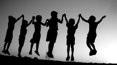 Kids jumping and holding hands