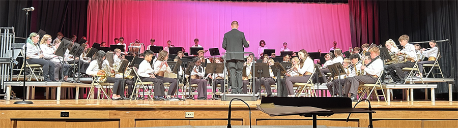 Belhaven Band members on stage playing their instruments at the Spring performance.