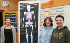  Students stand beside an Anomatage Table