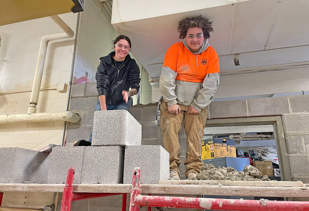 freshmen student, female working the electrical lab