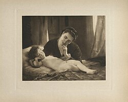 woman falling asleep while watching sleeping child