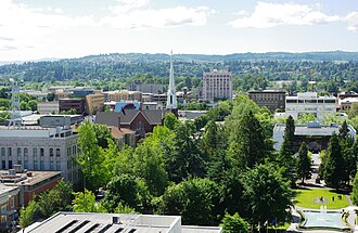 Several buildings in Downtown Salem against a backdrop of trees