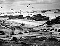 Image 12 Invasion of Normandy Photo credit: United States Coast Guard Landing ships putting ashore on Omaha Beach at low tide during the first days of the Invasion of Normandy, mid-June, 1944. Barrage balloons fly overhead and U.S. Army "half-tracks" form a convoy on the beach. The Normandy landing was the largest seaborne invasion in history, with almost three million troops crossing the English Channel. More featured pictures