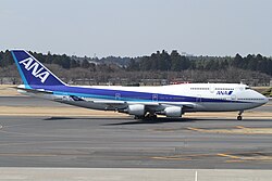 An ANA's 747-400 with first revamped "Triton blue" livery