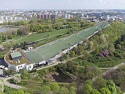 Artificial hill in Szczęśliwice Park, with a ski slope