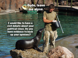 A photograph of a black sea lion and a white man standing in fatigues holding a bucket. Both are on concrete and rock by a water pond. The sea lion is captioned as "I would like to have a civil debate about your political views. Do you have evidence to back up your opinions?". The man is captioned as "Dude, leave me alone."