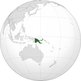 Papua New Guinea in green with Southeast Asia and other areas of Asia to its west and northwest, Australia to the south, and the large Pacific ocean to the east