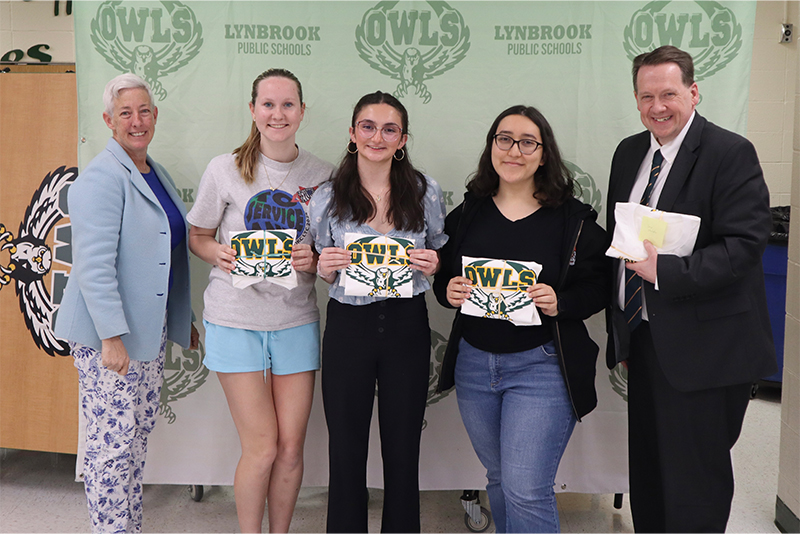 5 People with a few holding certificates