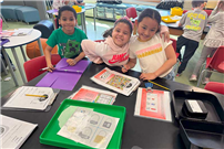 Students smiling at camera while completing module. thumbnail265755