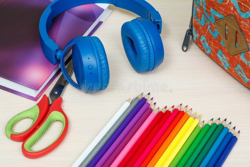 headphones, colored pencils and scissors