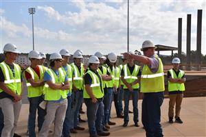 Group of students observing design of concrete terrace 