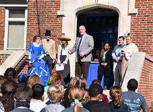 Finley Koswoski standing with her James Clemens High principal Brian Clayton on steps of Madison Elementary