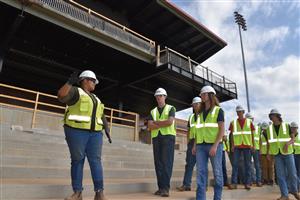 Students underneath unfinished upper deck 