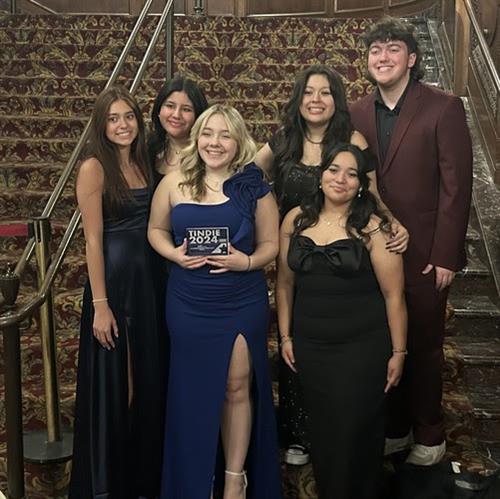 Six students in formal wear holding 2024 Indie Award
