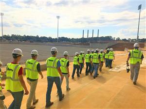 Students walking perimeter of stadium 