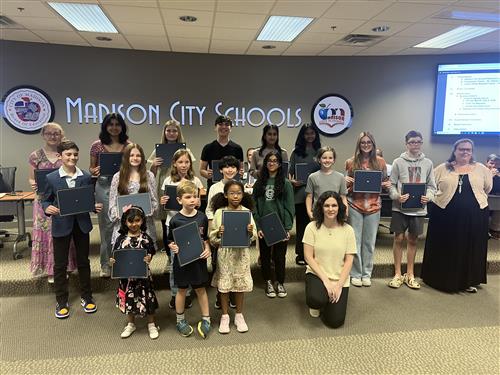 PTA reflections winners standing in front of the board room