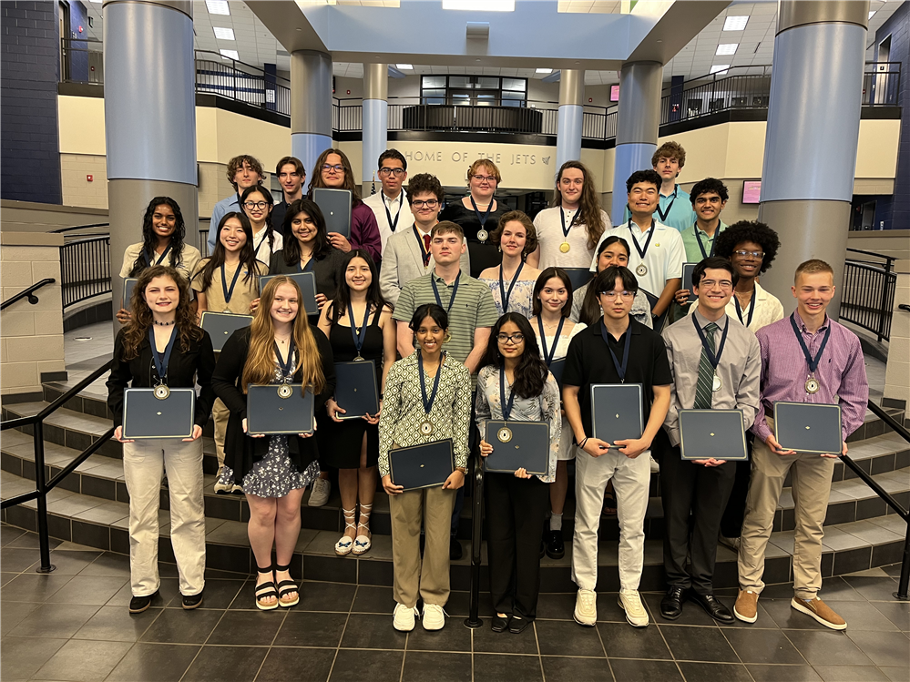 Photo of graduating seniors from the class of 2024 with their Seal of Biliteracy medals and certificates