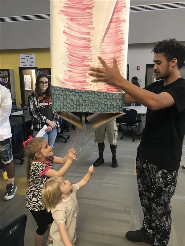  Student demonstrates his idea for a gender reveal business.