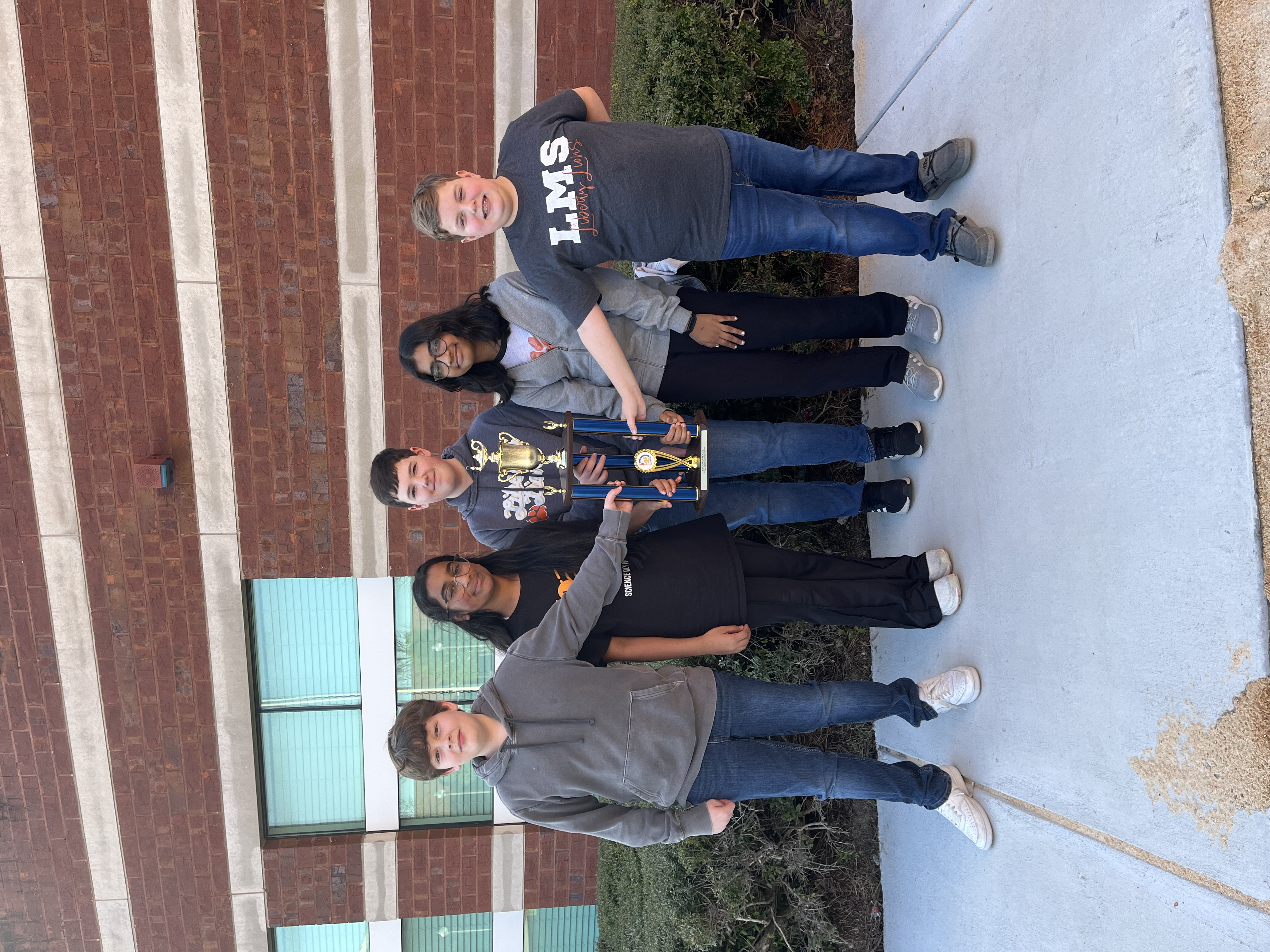 Team with trophy.