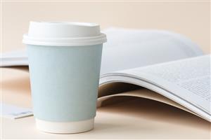 Open book and coffee cup 