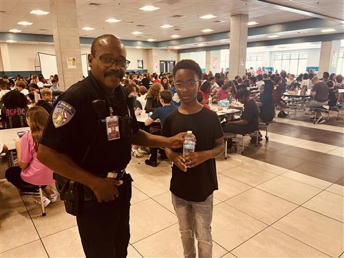 SRO at Discovery Middle with student in lunchroom
