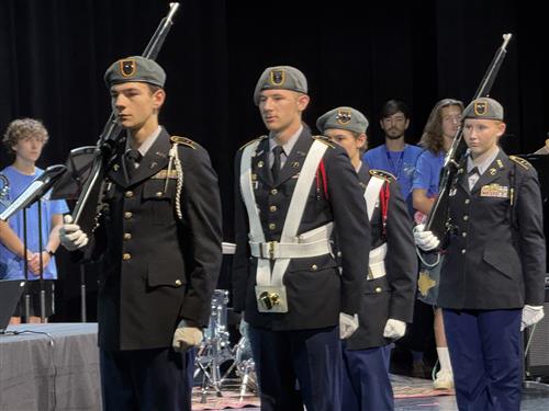 color guard in formation at Impact Aid Ceremony at James CLemens High School