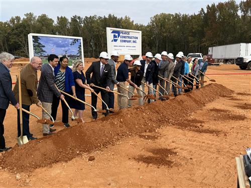 lineup of shovelturning dirt