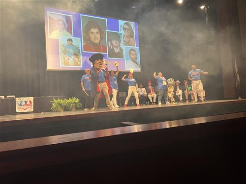 Bob Jones Patriot mascot and principal dancing on stage