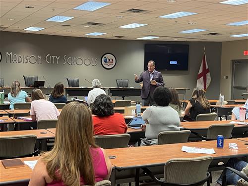 Dr. Ed Nichols addressing a board room full of PTA officers