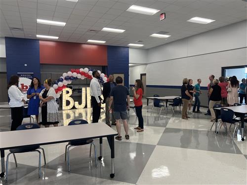 parents and others visiting the multi-purpose room of the new SPED wing at Bob Jones High School