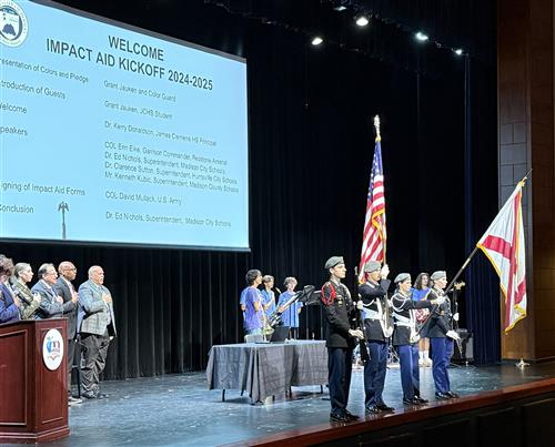  Superintendents on stage with color guard presenting the flag