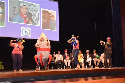 mascot on stage dancing for rainbow elementary