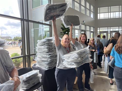 Staff members handing out swag