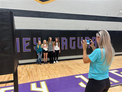 mom taking pics of students